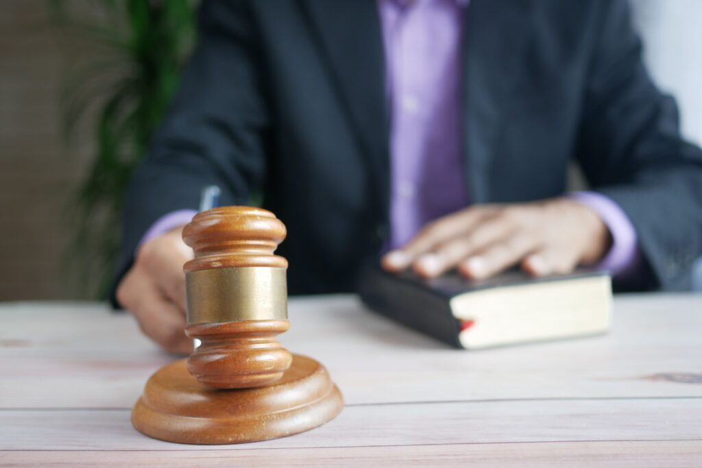 pexels-photo-8693379-8693379 A wooden gavel and legal book represent justice in a court setting, emphasizing order and legal authority.